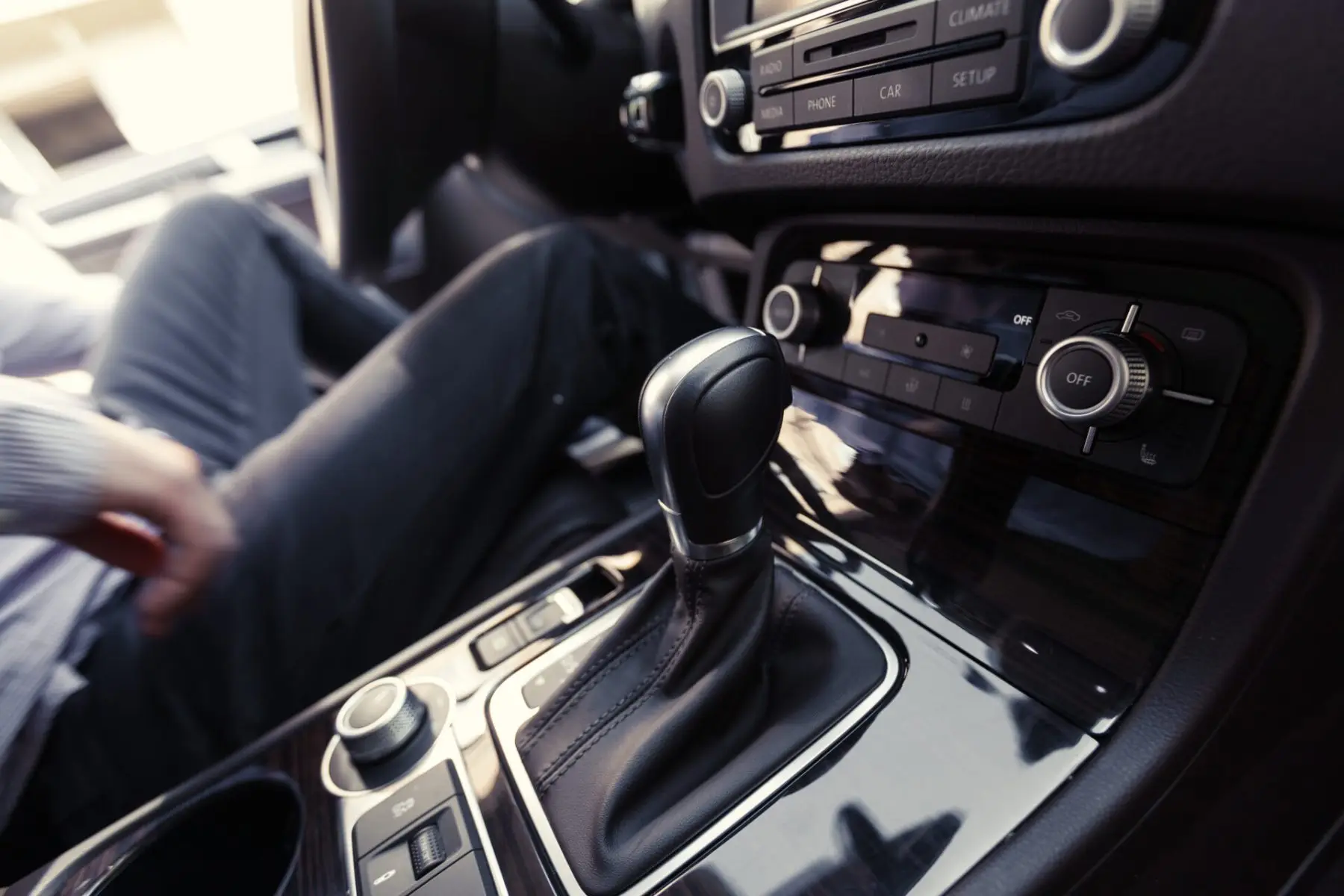 Driver pressing the engine start button before a driving lesson